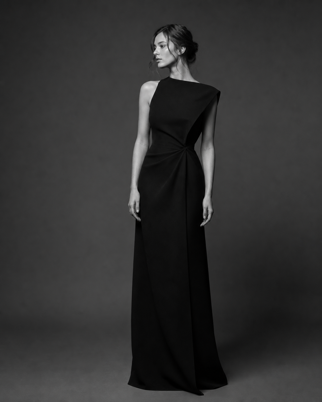 A sculptural ERAVINE black dress studied in profile